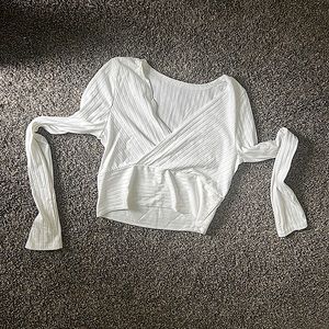 White long sleeve shirt with a crossed v-neck. Size: 6